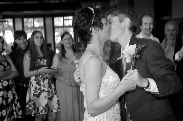 Brides kiss during first dance - Bancroft Hotel Wedding Reception - Bancroft Hotel Berkeley