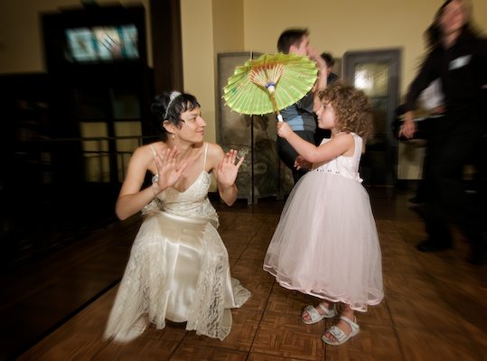 Bride bends down to connect with flower girl - Bancroft Hotel Wedding Reception - Bancroft Hotel Berkeley