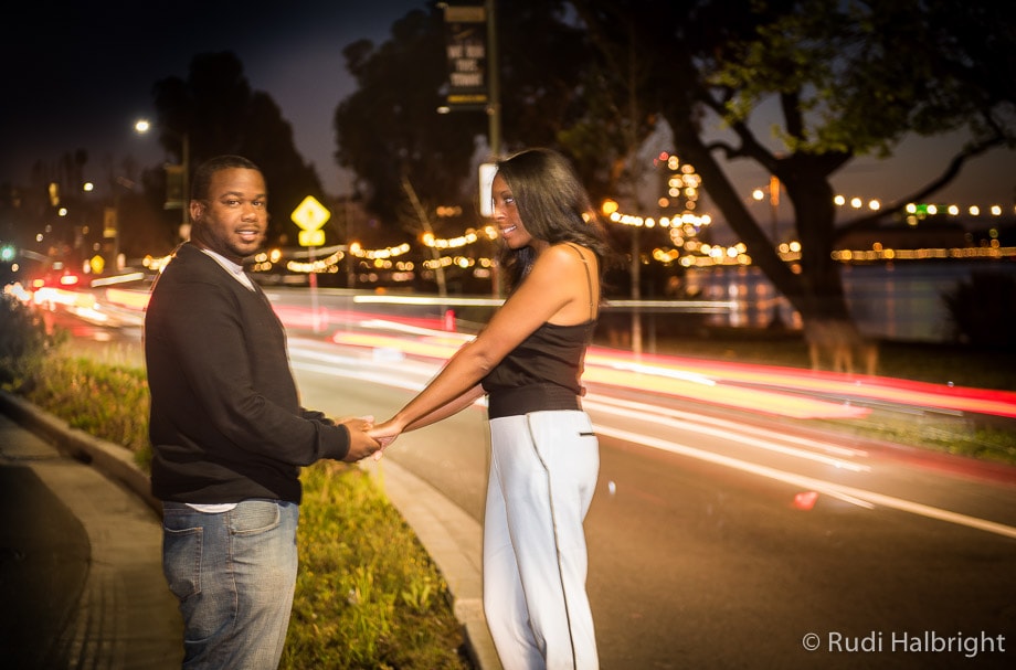 Engagement portrait - Lake Merritt - Oakland, California - trailing lights from cars 