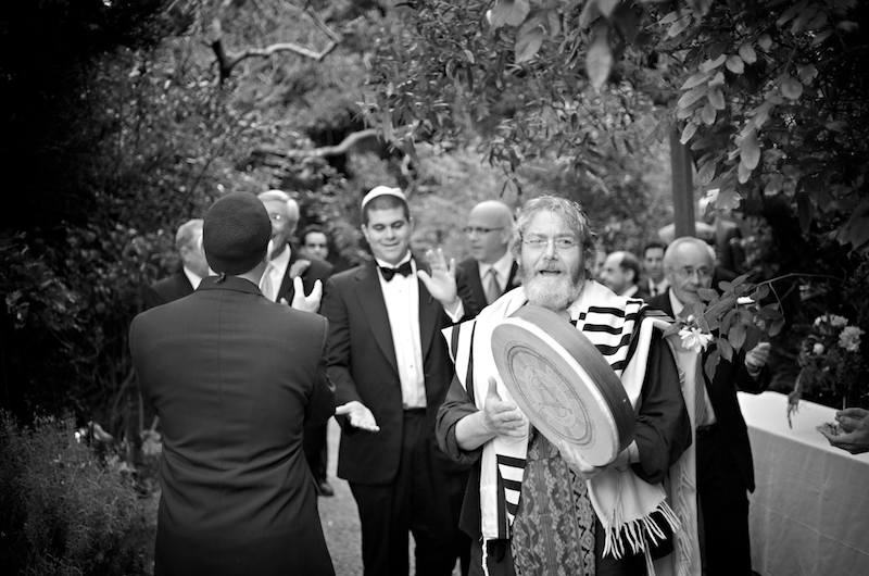 Avram Davis leads Josh and his entourage on their march to join the women - Jewish Wedding - Bodega Bay