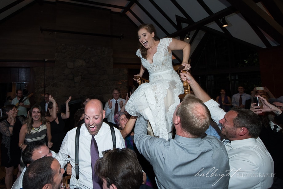 The Bride is lifted up on a chair during the Hora at her wedding in the Brazil Room in Berkeley