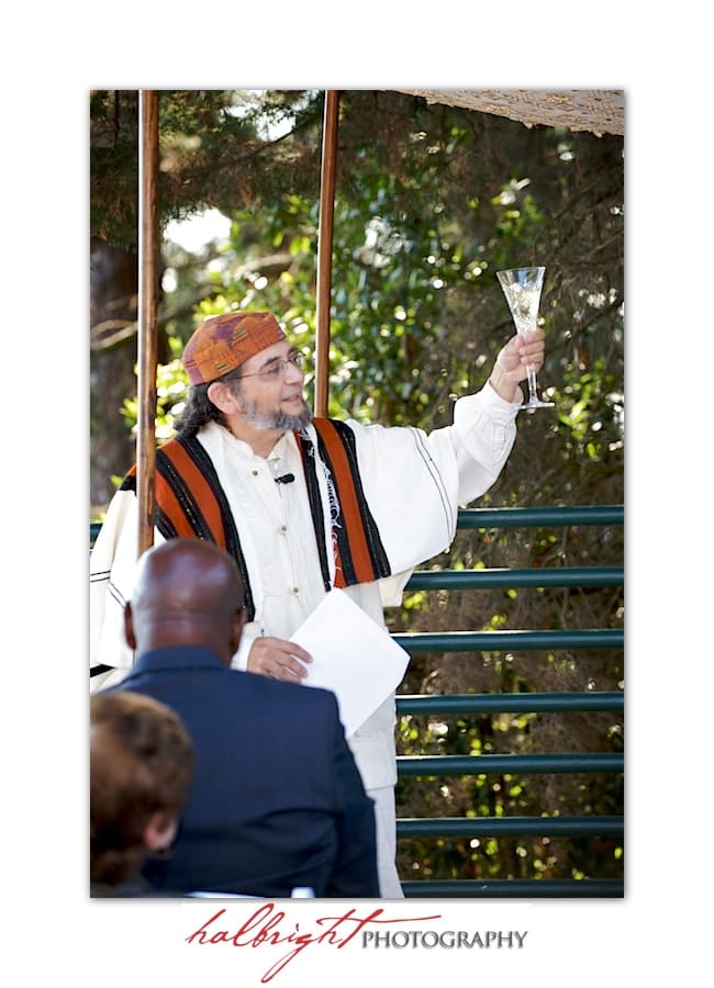 Rabbi David Cooper of Kehillah Community Congregation says a blessing over the wine - Wedding Ceremony - Joaquin Miller Park and Community Center