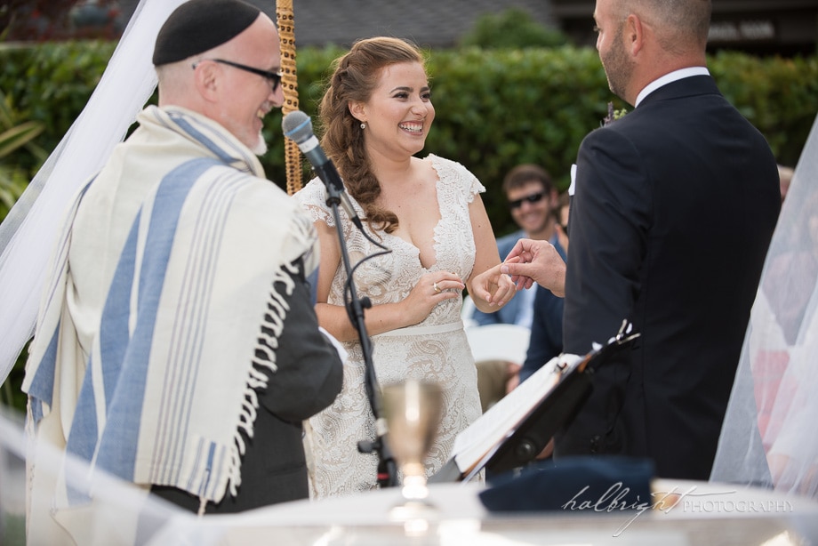 Brazil Room Wedding - Bride smiles as groom puts ring on her hand - Tilden Park Wedding - Berkeley Wedding Photography