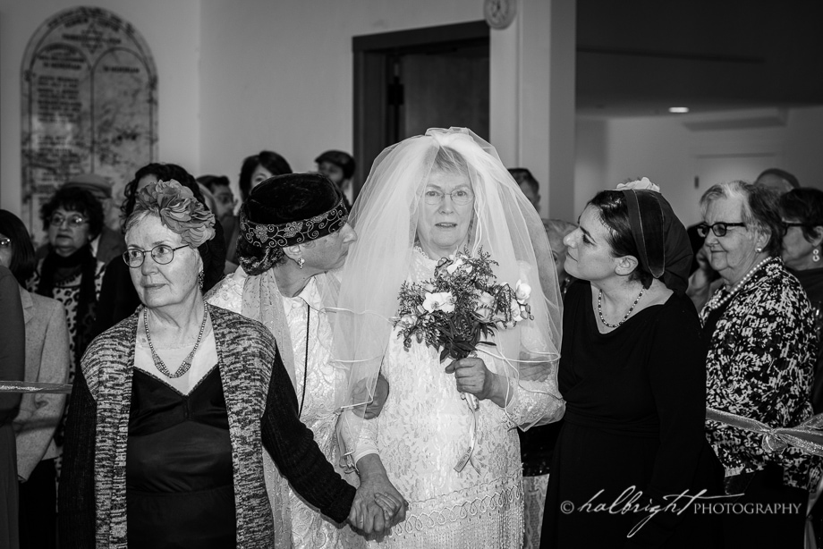 The bride is walked down the aisle at the start of the wedding ceremony