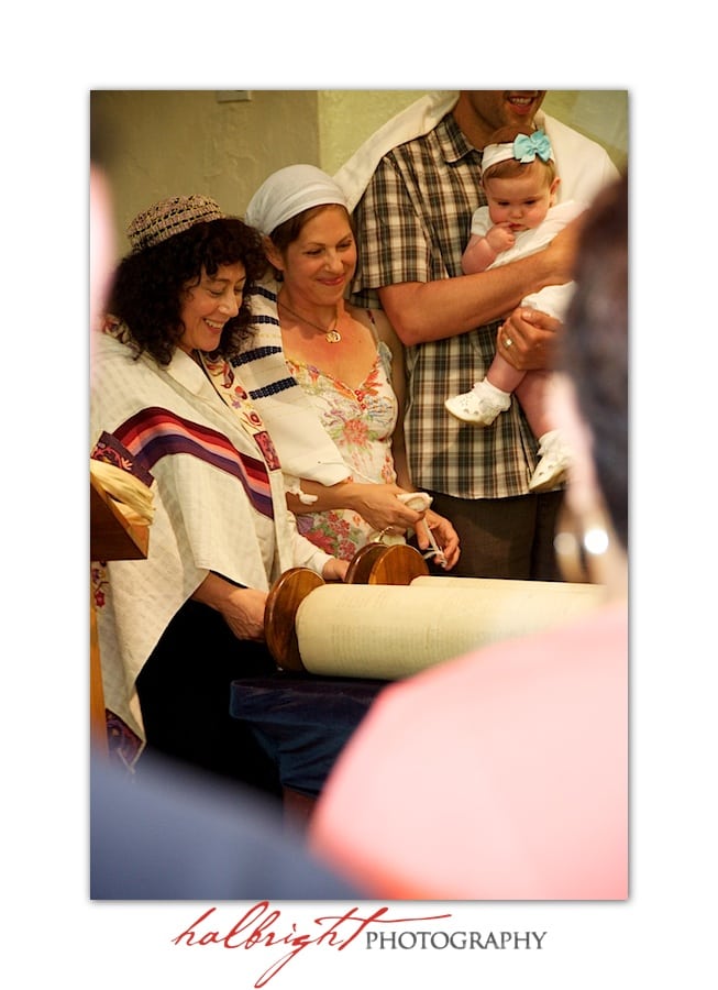 baby-laid-on-torah-during-naming-ceremony-at-chochmat-halev
