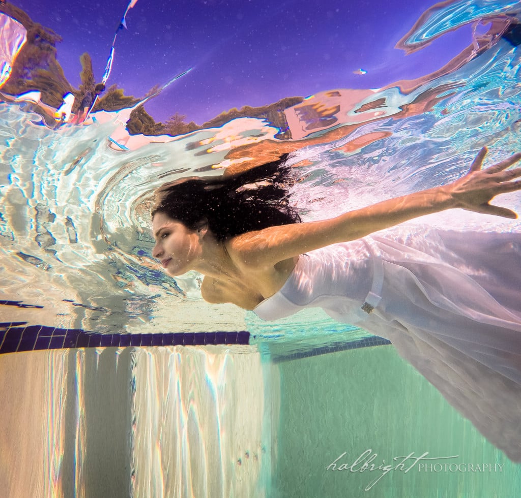 bride photographed underwater capturing her motion in the water - claremont hotel - berkeley - pool - berkeley wedding photographer