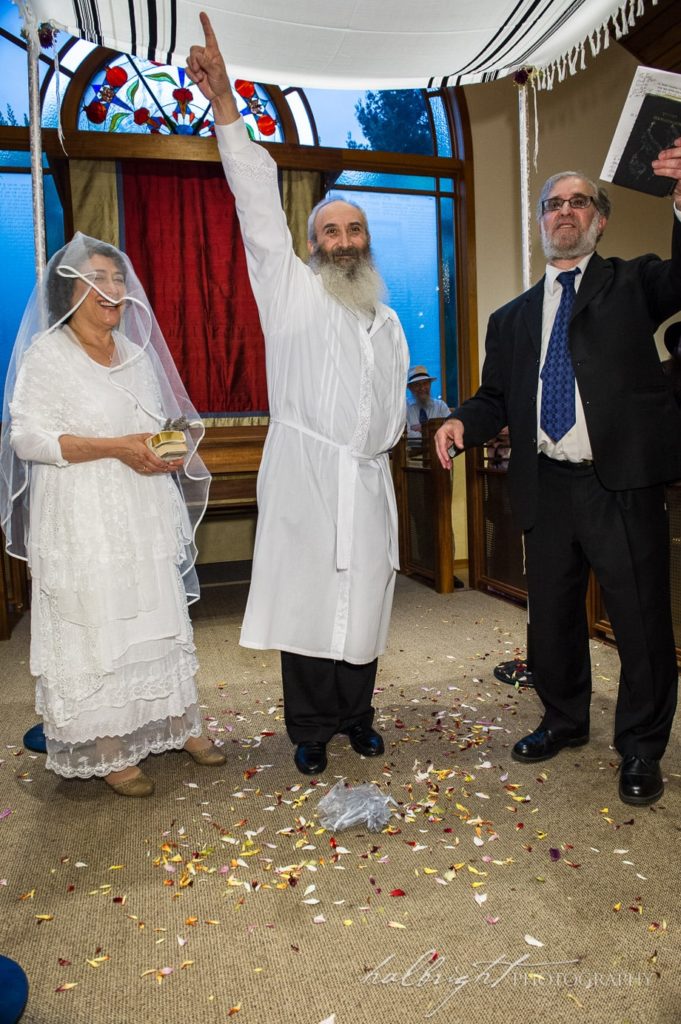 Groom prepares to break the glass at his orthodox Jewish Wedding in Berkeley, CA 