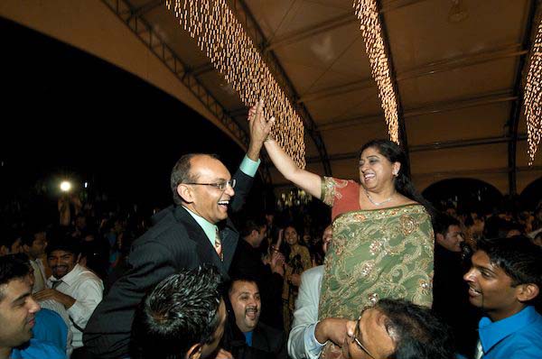 Parents of the Bride are raised up by friends and family - Indian Wedding - Gilroy Gardens Wedding