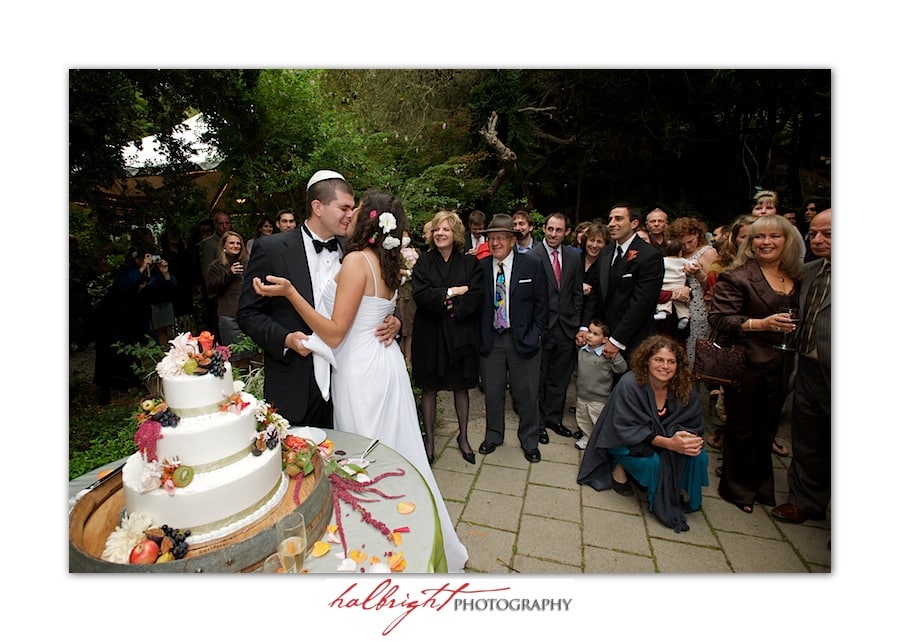 Bride and Groom Kiss after Cake Cutting - Bodega Bay Secret Gardens - Bodega Bay Wedding