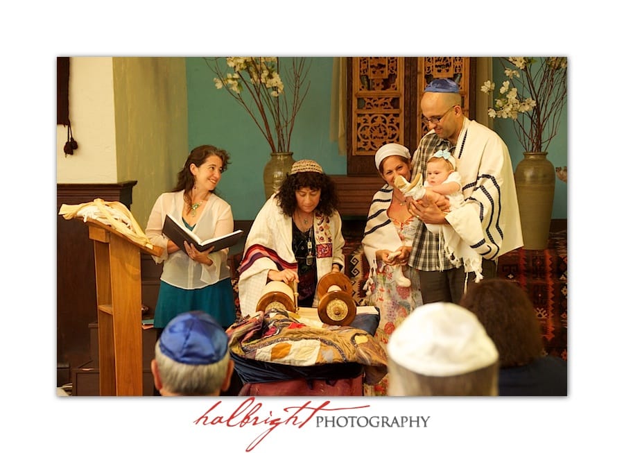 baby-laid-on-torah-during-naming-ceremony-at-chochmat-halev