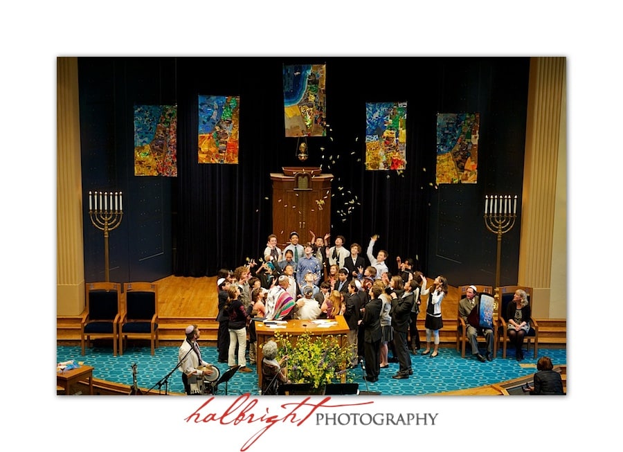 The kids throw candy in the air at the end of the ceremony - Temple Emanu-El