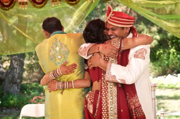 Bride and Groom receive hugs from their parents - Gilroy Gardens - Indian Wedding